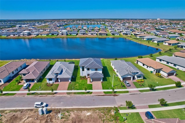 aerial view featuring a water view and a residential view