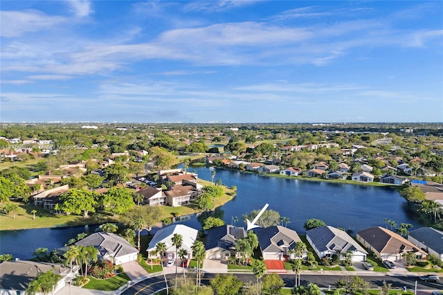 drone / aerial view with a water view and a residential view