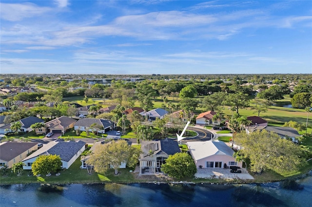 birds eye view of property featuring a residential view and a water view