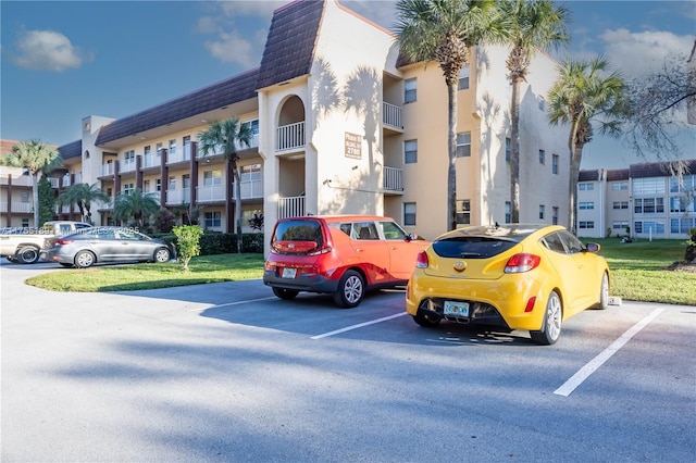 view of property with uncovered parking