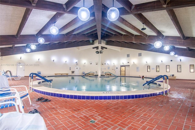 community pool featuring a hot tub