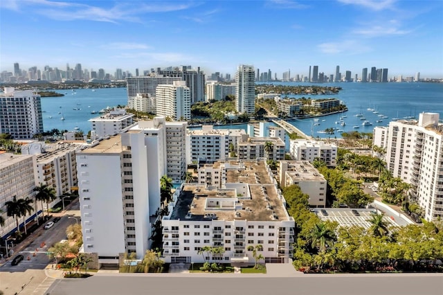 bird's eye view featuring a view of city and a water view