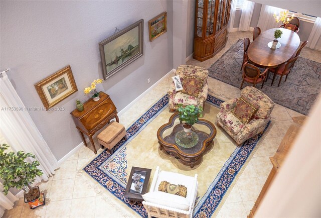 interior space with tile patterned floors and baseboards