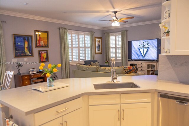 kitchen featuring ornamental molding, a sink, light countertops, dishwasher, and open floor plan