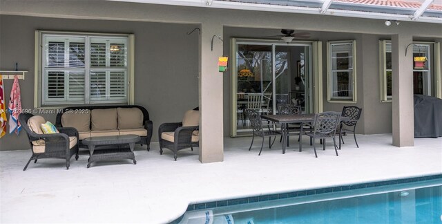 view of patio with an outdoor hangout area, outdoor dining space, an outdoor pool, a ceiling fan, and area for grilling