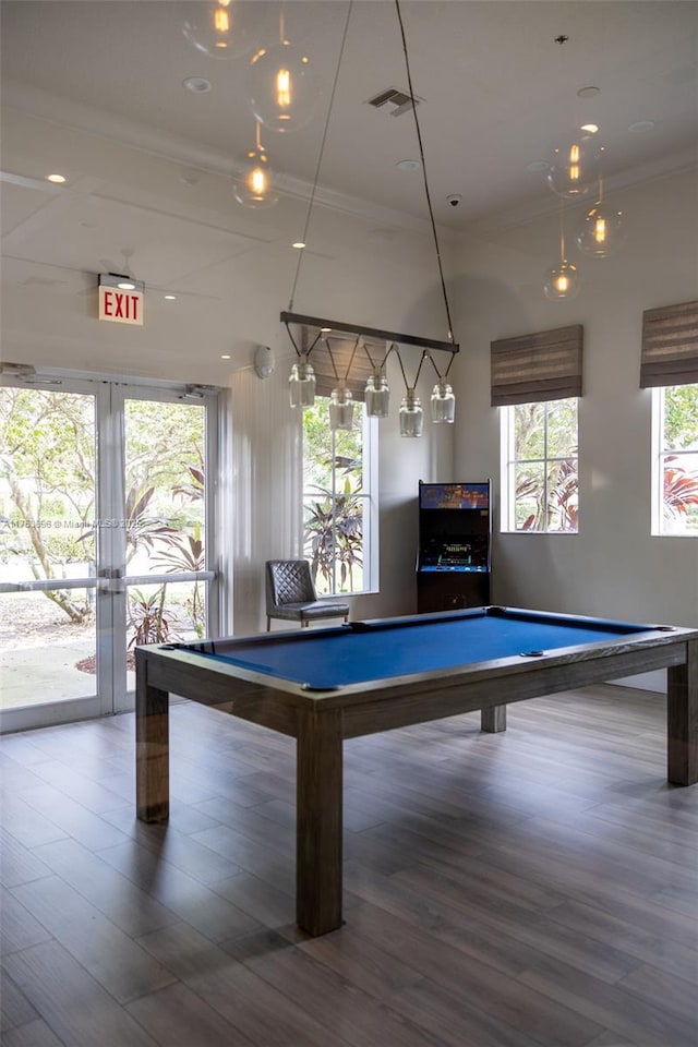 recreation room featuring visible vents, ornamental molding, wood finished floors, french doors, and pool table