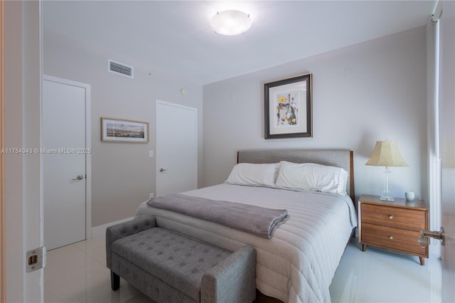 tiled bedroom featuring visible vents