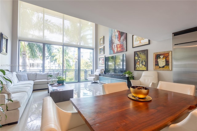 dining area featuring a wealth of natural light and expansive windows