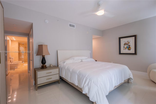 bedroom with ensuite bath, visible vents, and a ceiling fan