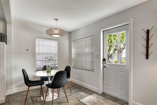 dining room with baseboards