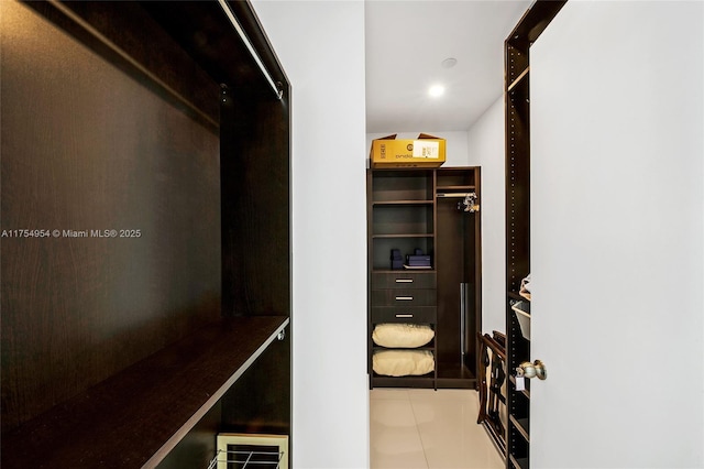 spacious closet with tile patterned flooring