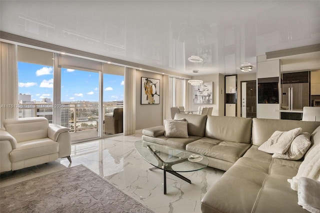 living area featuring marble finish floor and a view of city