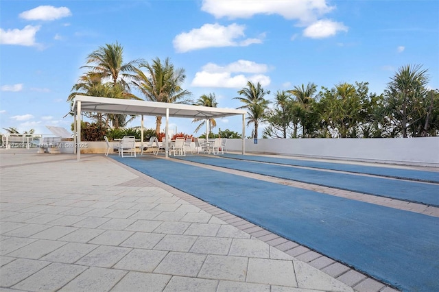 surrounding community featuring a patio area and fence