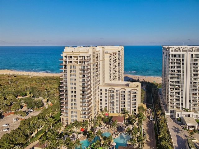 bird's eye view featuring a view of the beach and a water view