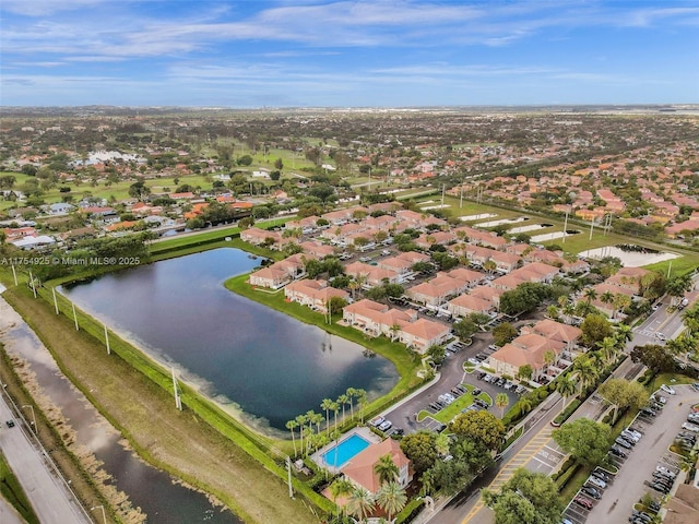 drone / aerial view featuring a water view and a residential view