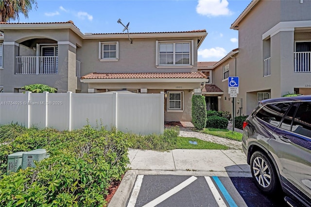 12611 SW 54th Ct Unit 12611, Miramar, FL 33027 - view of front of property featuring uncovered parking, a tile roof, and stucco siding