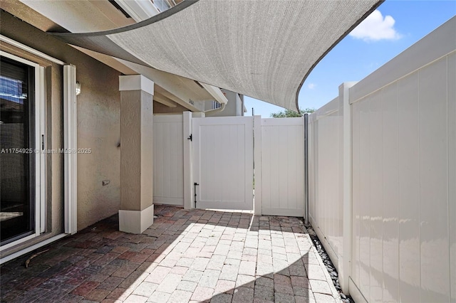 12611 SW 54th Ct Unit 12611, Miramar, FL 33027 - view of patio / terrace featuring a gate
