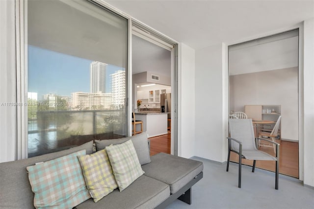 living room featuring a city view and visible vents