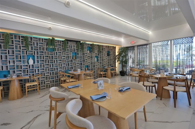 dining room featuring marble finish floor