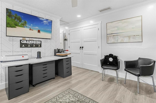 office area with baseboards, visible vents, crown molding, light wood-type flooring, and recessed lighting