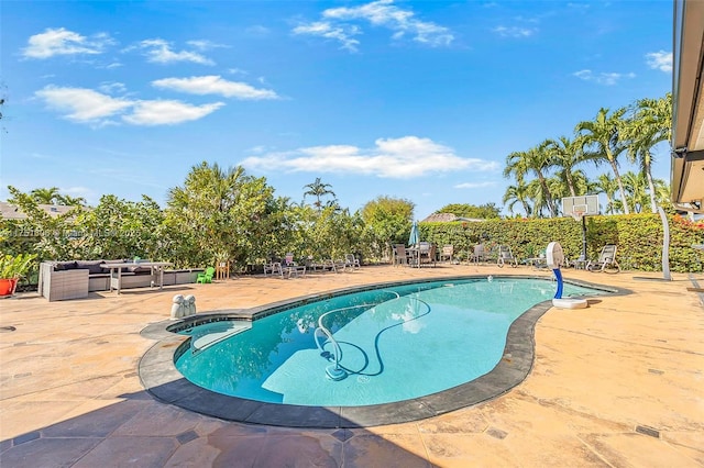 view of pool featuring an outdoor hangout area, a fenced in pool, and a patio