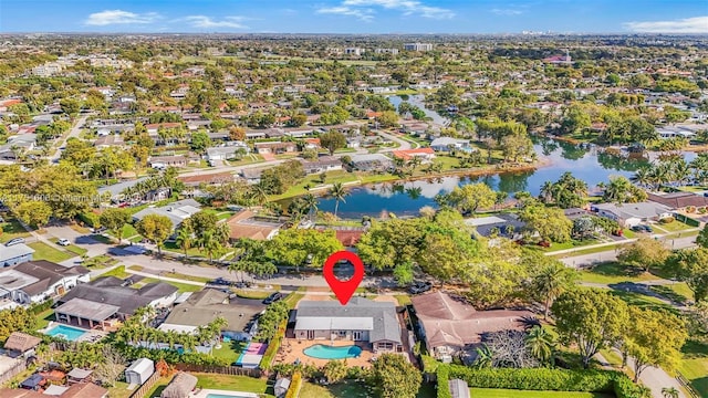 drone / aerial view with a water view and a residential view