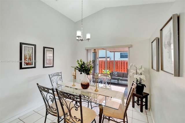 dining room with light tile patterned floors, baseboards, vaulted ceiling, and an inviting chandelier