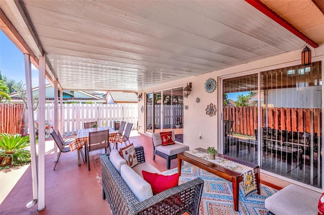 view of patio with outdoor lounge area, fence, and outdoor dining area