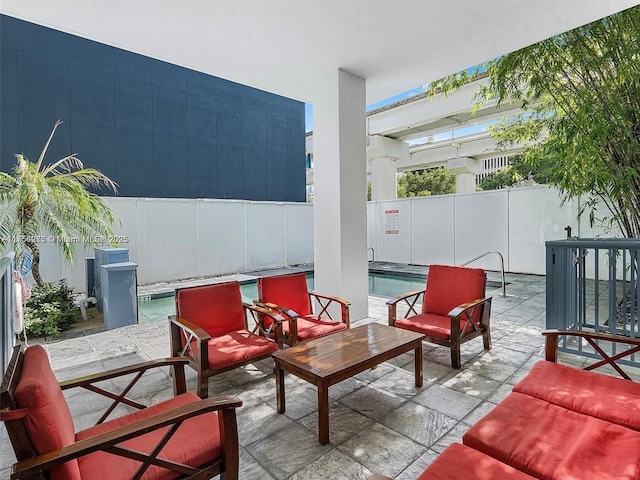 view of patio featuring fence and a community pool