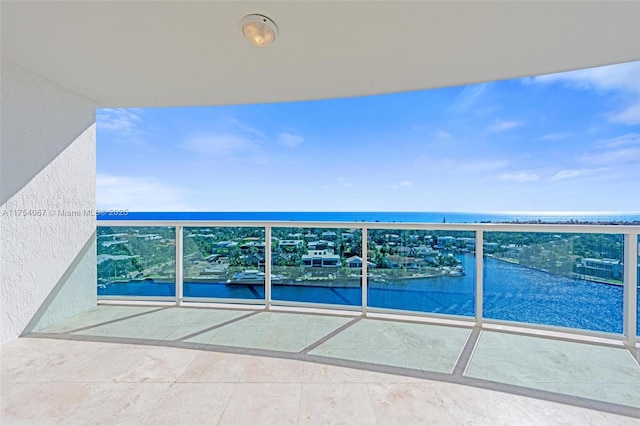 balcony featuring a water view