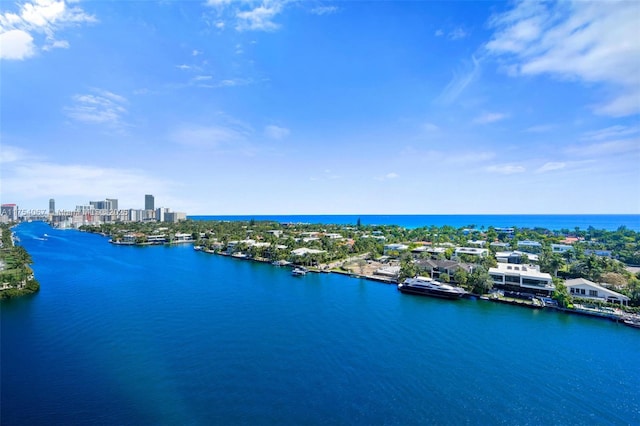 birds eye view of property featuring a view of city and a water view