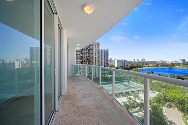 balcony featuring a view of city and a water view