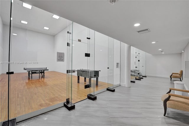 workout area with recessed lighting, visible vents, and baseboards