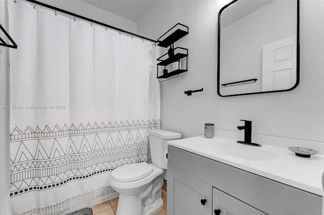 bathroom featuring toilet, a shower with curtain, tile patterned flooring, and vanity