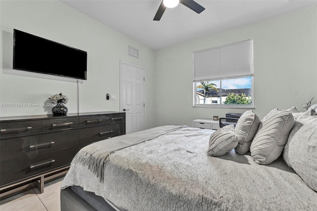 bedroom featuring ceiling fan and light tile patterned flooring