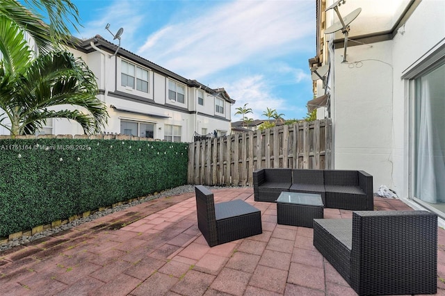 view of patio with fence and an outdoor living space