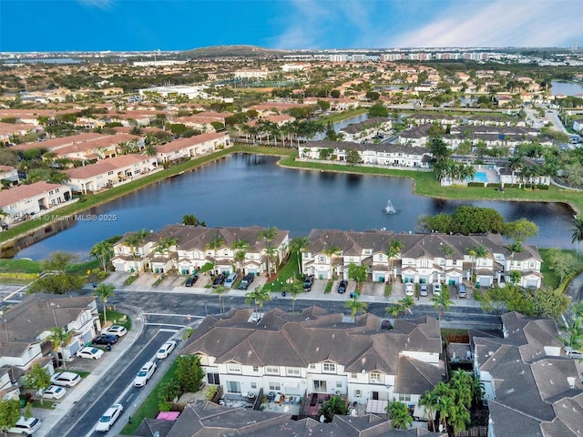 aerial view featuring a water view and a residential view