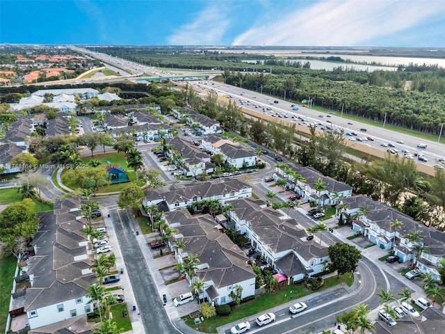 aerial view with a residential view and a water view