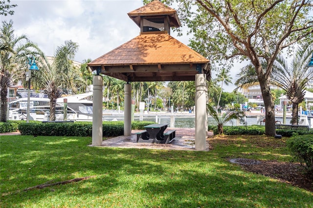 view of home's community with a lawn and a gazebo