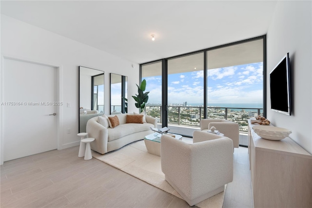 500 Alton Unit 3304, Miami Beach, FL 33139 - living area featuring healthy amount of natural light, light wood-type flooring, and expansive windows
