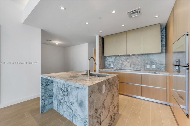 full bathroom with double vanity, tile walls, walk in shower, and a sink