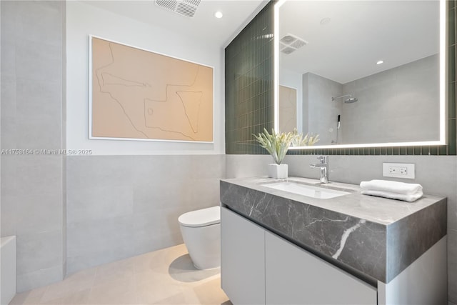 500 Alton Unit 3304, Miami Beach, FL 33139 - bathroom with tile walls, toilet, vanity, a shower, and recessed lighting