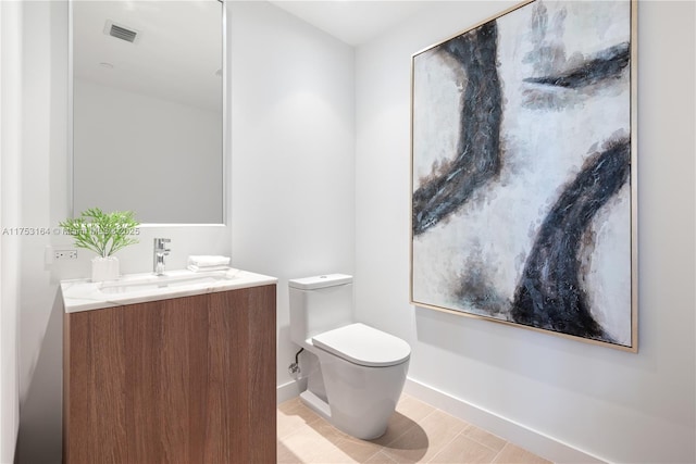 500 Alton Unit 3304, Miami Beach, FL 33139 - bathroom with vanity, toilet, baseboards, and tile patterned floors