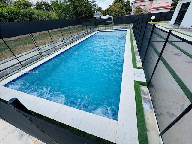 view of swimming pool with fence and a fenced in pool