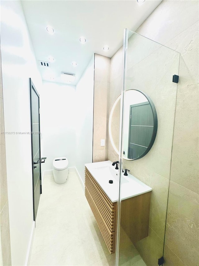 bathroom with vanity, toilet, recessed lighting, and visible vents