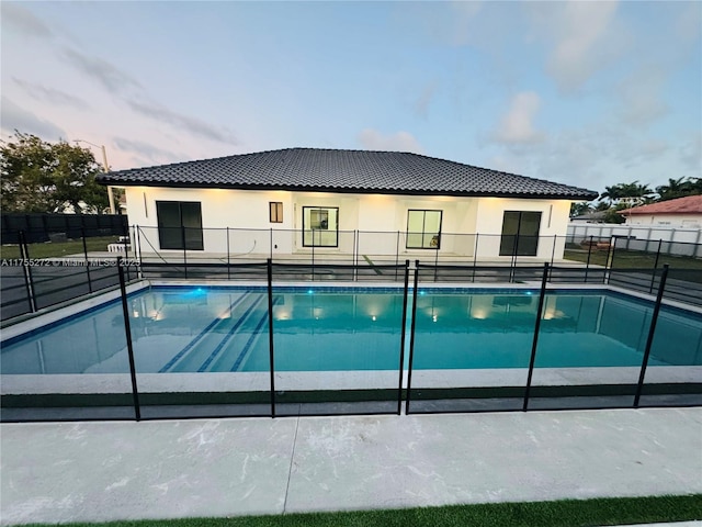 view of swimming pool with fence and a fenced in pool