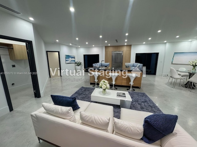 living room featuring recessed lighting, visible vents, concrete flooring, and baseboards