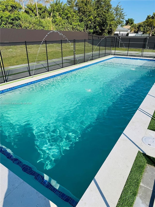 view of pool featuring a fenced in pool, a yard, and fence