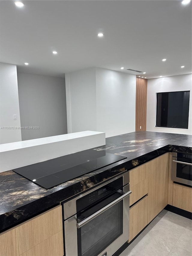 kitchen with stainless steel oven, black electric cooktop, recessed lighting, and light brown cabinets