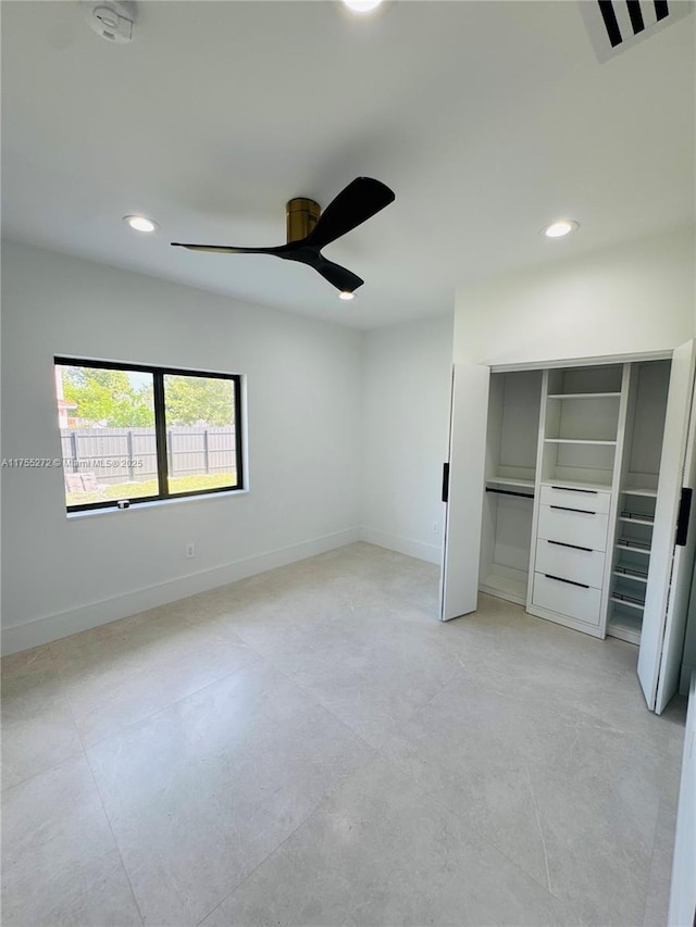 unfurnished bedroom featuring recessed lighting, a closet, baseboards, and ceiling fan